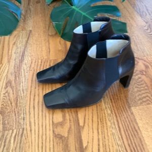 Chanel black leather booties with 3 inch heel, logo on heel and at opening.